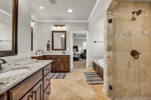 6108 E 95th St, Sperry, OK 74073 - ensuite bathroom featuring a shower stall, two vanities, ornamental molding, a bath, and recessed lighting