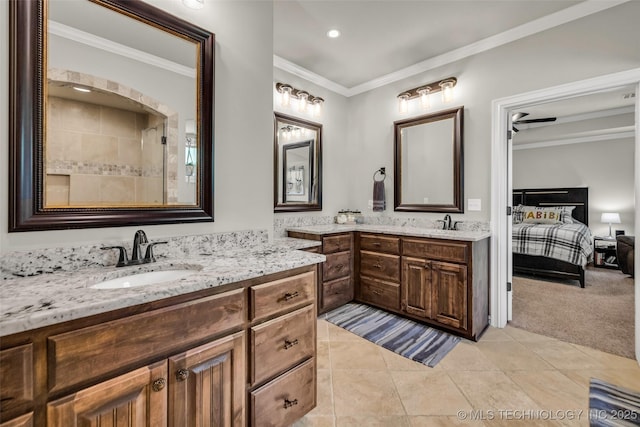 6108 E 95th St, Sperry, OK 74073 - ensuite bathroom featuring two vanities, crown molding, tile patterned floors, and recessed lighting