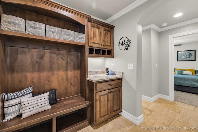 6108 E 95th St, Sperry, OK 74073 - mudroom with arched walkways, stone tile flooring, and crown molding