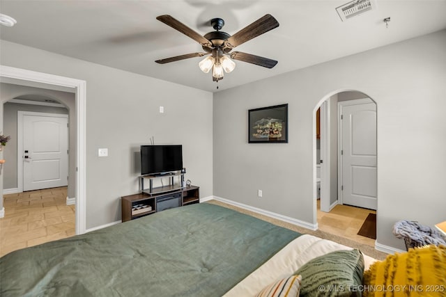 6108 E 95th St, Sperry, OK 74073 - living room featuring arched walkways and a ceiling fan