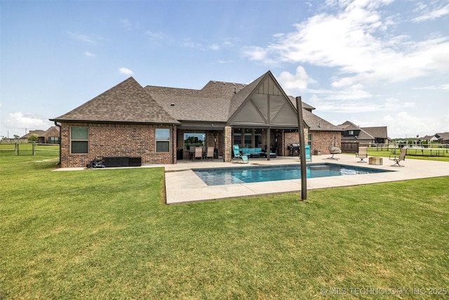 6108 E 95th St, Sperry, OK 74073 - rear view of property with a patio area, a shingled roof, an outdoor hangout area, and brick siding