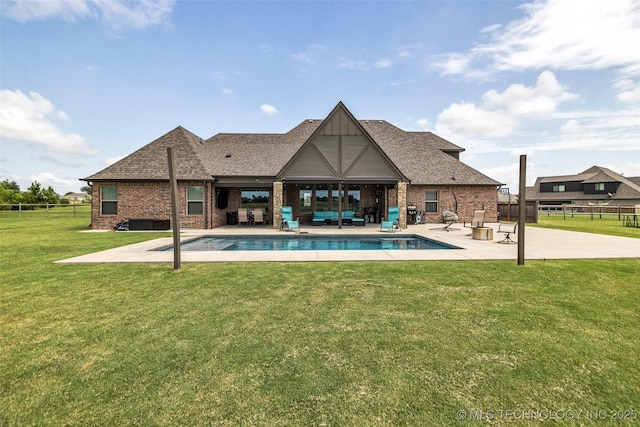 6108 E 95th St, Sperry, OK 74073 - back of house featuring a patio area, an outdoor living space, brick siding, and roof with shingles