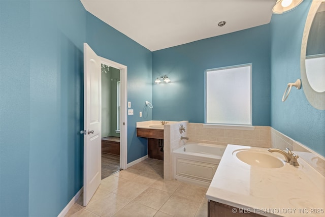 108 W 135th St, Skiatook, OK 74070 - bathroom featuring a garden tub, tile patterned floors, and vanity
