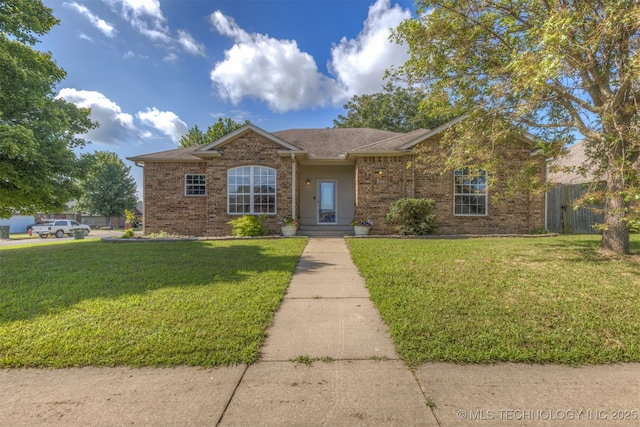 108 W 135th St, Skiatook, OK 74070 - view of front of home with a shingled roof and brick siding
