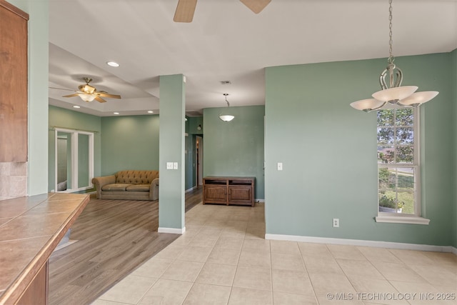 108 W 135th St, Skiatook, OK 74070 - unfurnished living room featuring a ceiling fan, recessed lighting, and light tile patterned floors