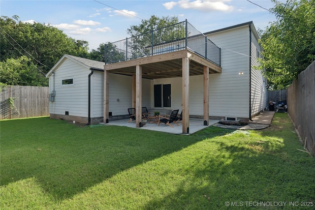3919 S Detroit Ave, Tulsa, OK 74105 - rear view of house with a fenced backyard, a wooden deck, and a patio
