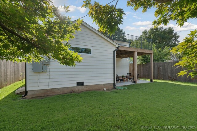 3919 S Detroit Ave, Tulsa, OK 74105 - back of property with a balcony, a fenced backyard, and a patio