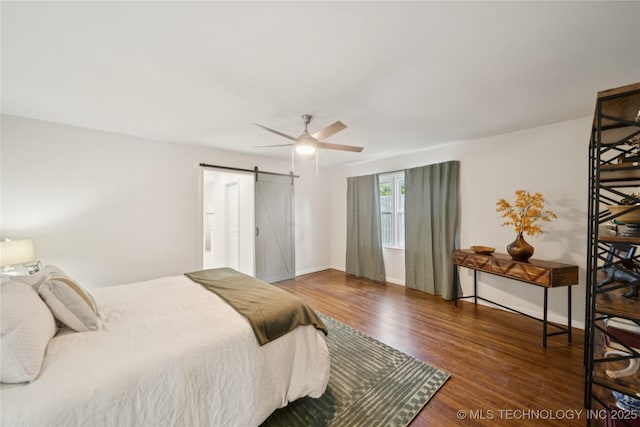 3919 S Detroit Ave, Tulsa, OK 74105 - bedroom with a barn door, wood finished floors, and ceiling fan
