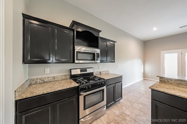 17409 E 44th St S, Tulsa, OK 74134 - kitchen with appliances with stainless steel finishes, dark cabinetry, light countertops, and recessed lighting