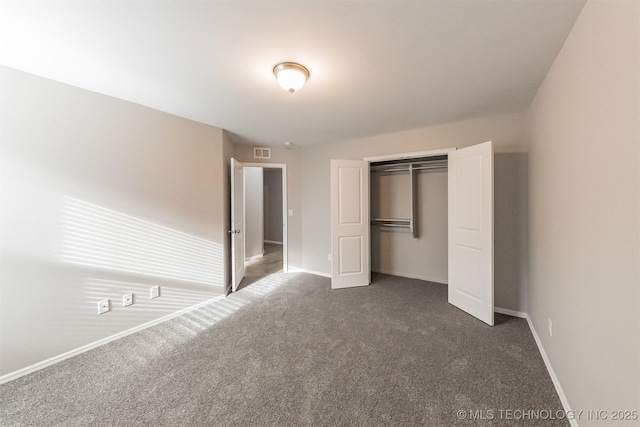 17409 E 44th St S, Tulsa, OK 74134 - unfurnished bedroom featuring dark carpet and a closet