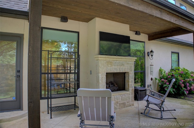 4401 S Yellow Pine Ave, Broken Arrow, OK 74011 - view of patio with an outdoor stone fireplace