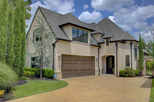 4401 S Yellow Pine Ave, Broken Arrow, OK 74011 - view of front of property with stone siding, driveway, stucco siding, a shingled roof, and an attached garage