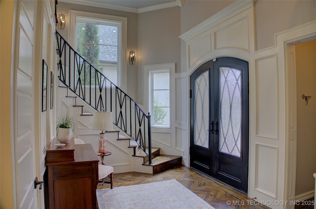 4401 S Yellow Pine Ave, Broken Arrow, OK 74011 - foyer featuring stairway, french doors, a decorative wall, plenty of natural light, and crown molding