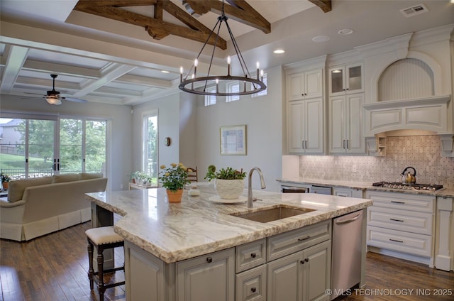4401 S Yellow Pine Ave, Broken Arrow, OK 74011 - kitchen with open floor plan, beamed ceiling, dark wood-style floors, an island with sink, and white cabinets