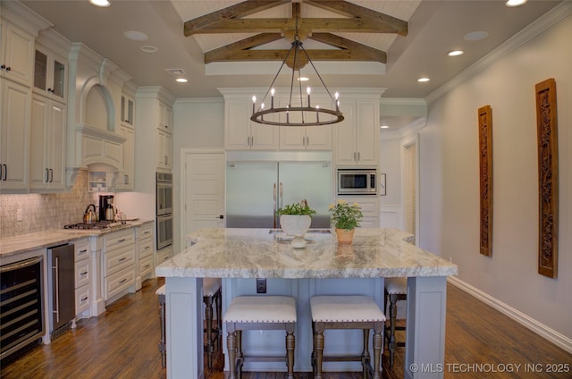 4401 S Yellow Pine Ave, Broken Arrow, OK 74011 - kitchen with built in appliances, beverage cooler, backsplash, recessed lighting, and dark wood finished floors