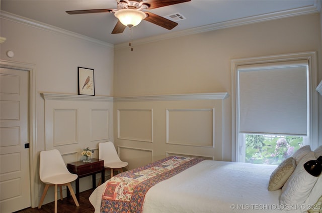 4401 S Yellow Pine Ave, Broken Arrow, OK 74011 - bedroom with ornamental molding, dark wood-type flooring, ceiling fan, and a decorative wall