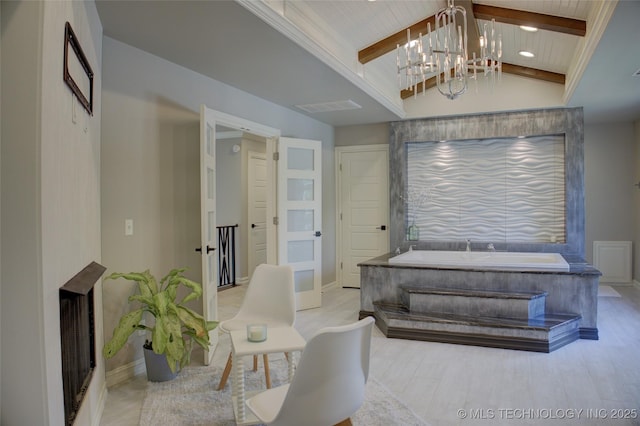 4401 S Yellow Pine Ave, Broken Arrow, OK 74011 - full bath featuring a chandelier, a bath, and wood finished floors