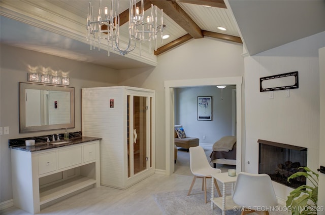 4401 S Yellow Pine Ave, Broken Arrow, OK 74011 - full bath with vanity, beamed ceiling, a chandelier, high vaulted ceiling, and a fireplace