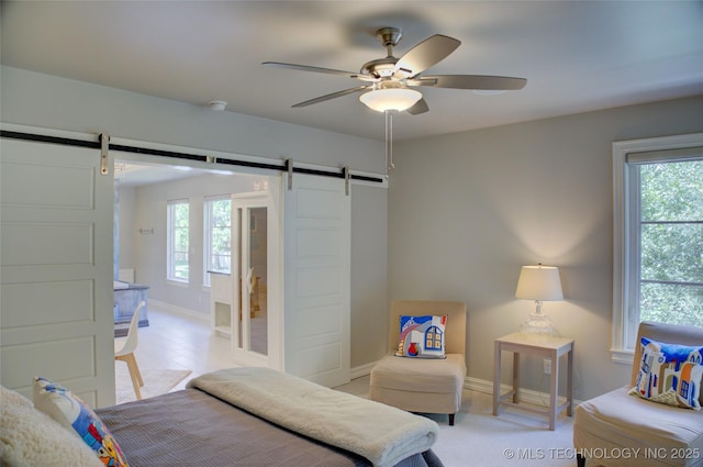 4401 S Yellow Pine Ave, Broken Arrow, OK 74011 - bedroom featuring a barn door, multiple windows, and ceiling fan