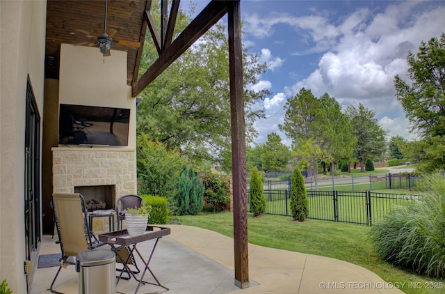 4401 S Yellow Pine Ave, Broken Arrow, OK 74011 - view of patio featuring an outdoor stone fireplace and ceiling fan