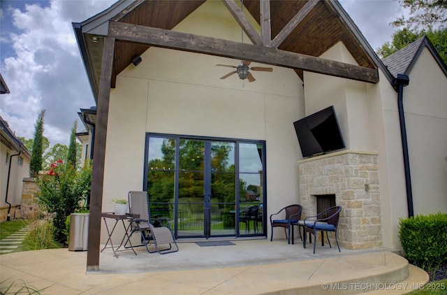 4401 S Yellow Pine Ave, Broken Arrow, OK 74011 - view of patio featuring ceiling fan and an outdoor stone fireplace