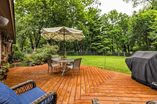 9601 Spring Lake Dr, Broken Arrow, OK 74014 - wooden terrace featuring outdoor dining space, a fenced backyard, a grill, and view of scattered trees