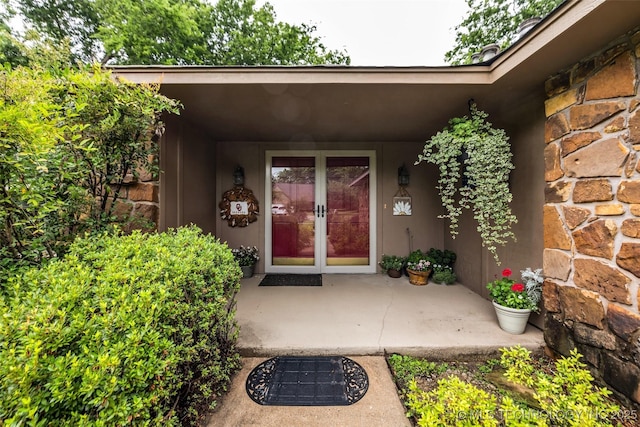 9601 Spring Lake Dr, Broken Arrow, OK 74014 - entrance to property with french doors, stone siding, and stucco siding