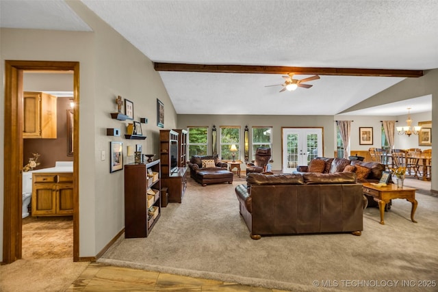 9601 Spring Lake Dr, Broken Arrow, OK 74014 - living room with light colored carpet, a textured ceiling, ceiling fan, and a chandelier