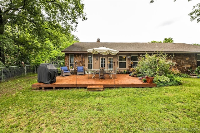 9601 Spring Lake Dr, Broken Arrow, OK 74014 - rear view of property with french doors, a wooden deck, stone siding, and a chimney