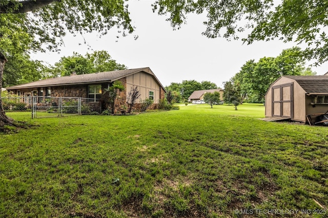 9601 Spring Lake Dr, Broken Arrow, OK 74014 - view of yard with a storage unit and a gate