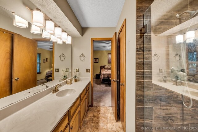 9601 Spring Lake Dr, Broken Arrow, OK 74014 - full bath with ensuite bath, a stall shower, vanity, and a textured ceiling