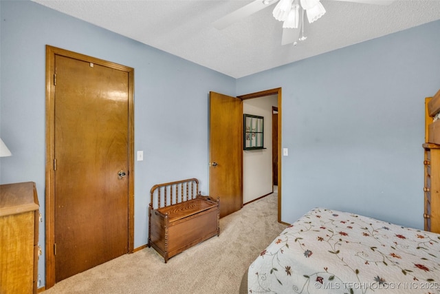 9601 Spring Lake Dr, Broken Arrow, OK 74014 - bedroom featuring light colored carpet, ceiling fan, and a textured ceiling