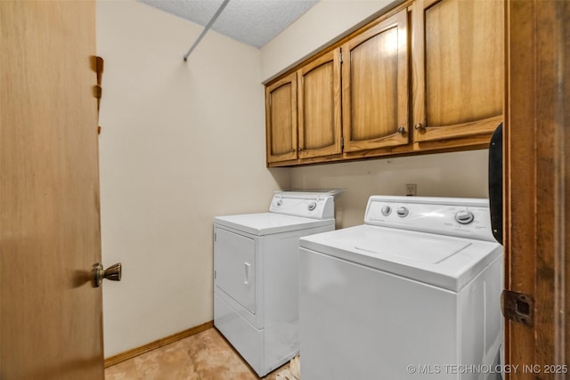 9601 Spring Lake Dr, Broken Arrow, OK 74014 - washroom featuring cabinet space, washing machine and clothes dryer, and a textured ceiling