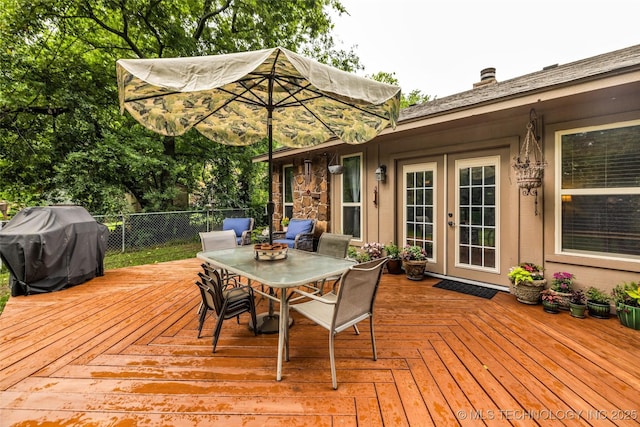 9601 Spring Lake Dr, Broken Arrow, OK 74014 - wooden deck with french doors, grilling area, and outdoor dining area