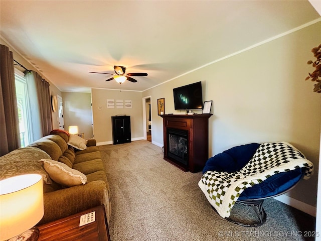 401 High St, Eufaula, OK 74432 - living room featuring carpet, ceiling fan, a glass covered fireplace, and ornamental molding