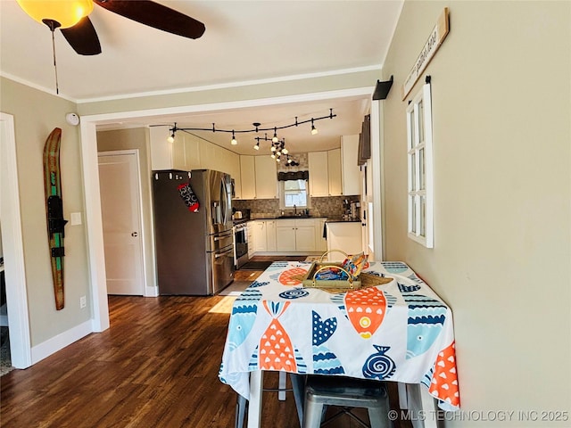 401 High St, Eufaula, OK 74432 - kitchen with appliances with stainless steel finishes, dark wood-style floors, tasteful backsplash, ceiling fan, and white cabinetry