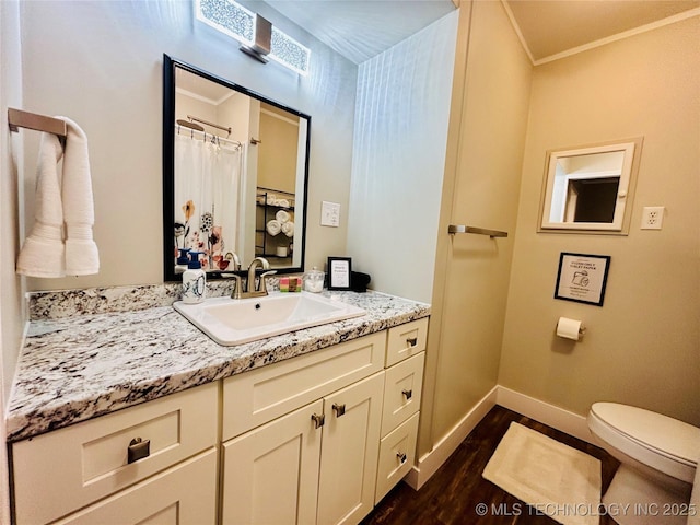 401 High St, Eufaula, OK 74432 - bathroom with wood finished floors, vanity, and ornamental molding
