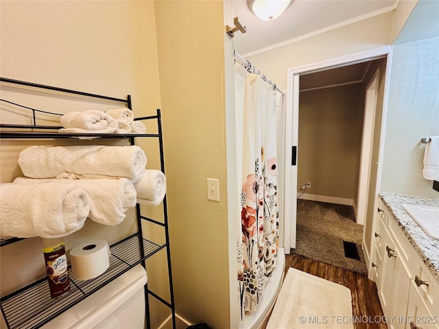 401 High St, Eufaula, OK 74432 - bedroom featuring dark wood-style floors and crown molding