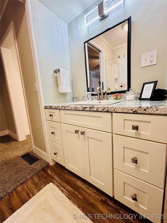 401 High St, Eufaula, OK 74432 - bathroom with vanity and wood finished floors
