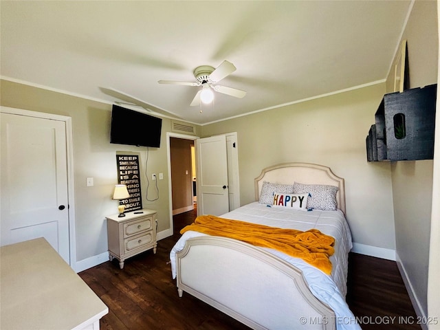 401 High St, Eufaula, OK 74432 - bedroom with dark wood finished floors, ornamental molding, and a ceiling fan