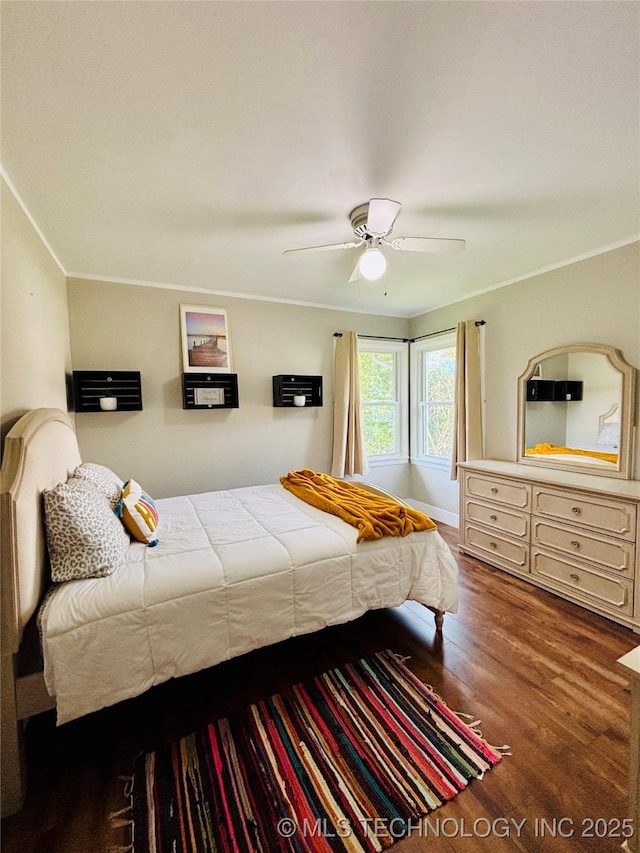 401 High St, Eufaula, OK 74432 - bedroom with wood finished floors, crown molding, and a ceiling fan