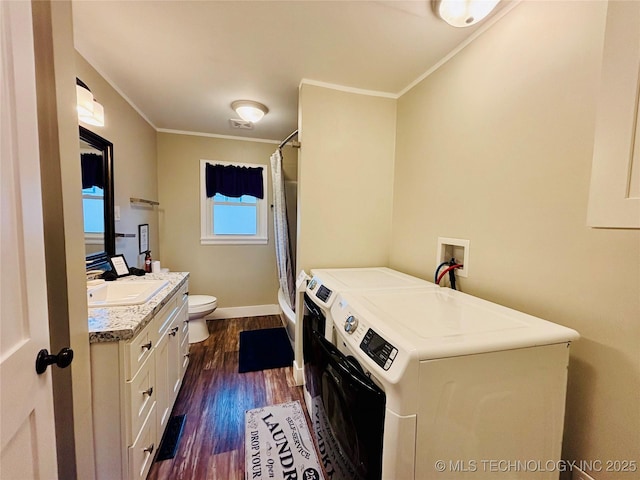 401 High St, Eufaula, OK 74432 - laundry area with washer and dryer, crown molding, and dark wood-style flooring