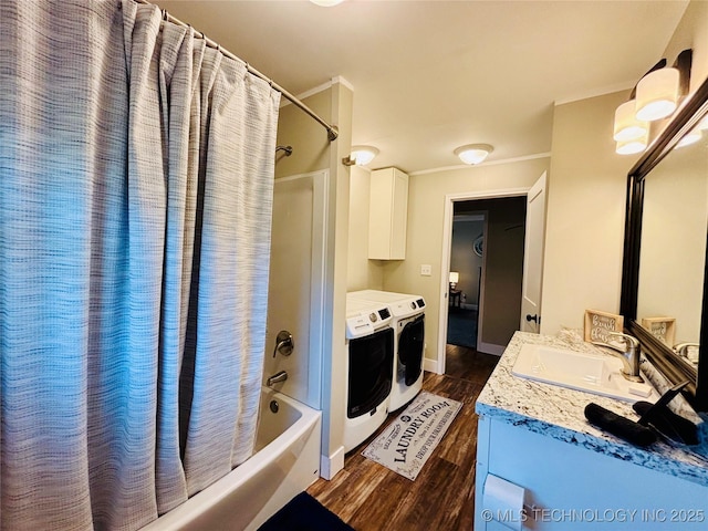 401 High St, Eufaula, OK 74432 - bathroom with washing machine and clothes dryer, shower / bath combination with curtain, wood finished floors, vanity, and ornamental molding