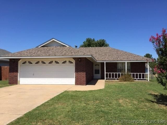 9375 E 530th Rd, Claremore, OK 74019 - ranch-style home with brick siding, concrete driveway, a garage, and a front lawn