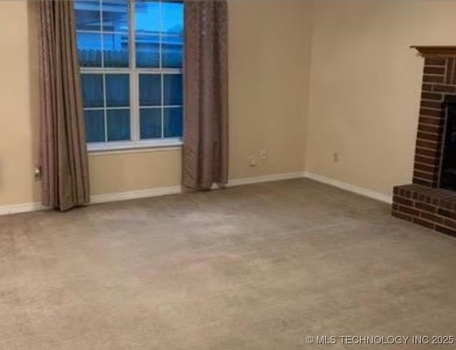 9375 E 530th Rd, Claremore, OK 74019 - unfurnished living room with carpet floors and a fireplace