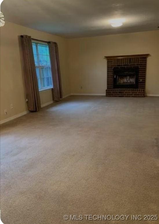 9375 E 530th Rd, Claremore, OK 74019 - unfurnished living room with carpet floors and a brick fireplace
