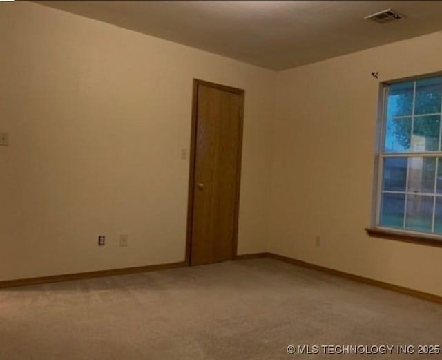 9375 E 530th Rd, Claremore, OK 74019 - empty room featuring light colored carpet and baseboards