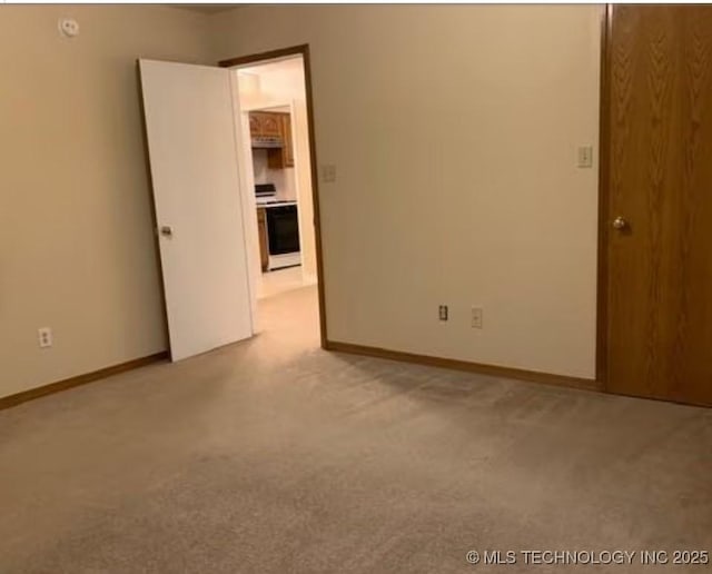 9375 E 530th Rd, Claremore, OK 74019 - unfurnished room featuring light colored carpet and baseboards