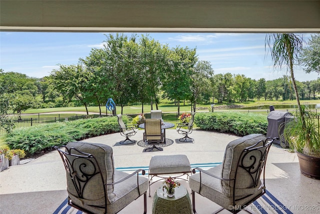 8701 E Hartford St, Broken Arrow, OK 74014 - view of patio featuring grilling area and view of wooded area