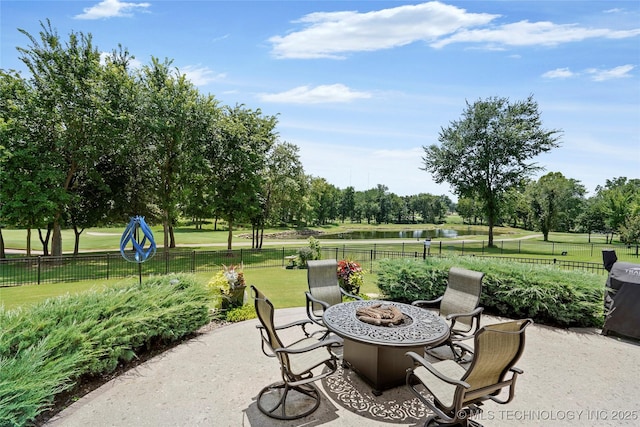 8701 E Hartford St, Broken Arrow, OK 74014 - view of patio with an outdoor fire pit, a water view, and view of wooded area